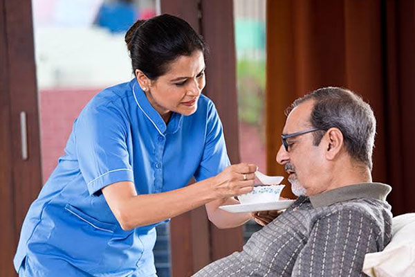Hospital attendant caring for admitted patient