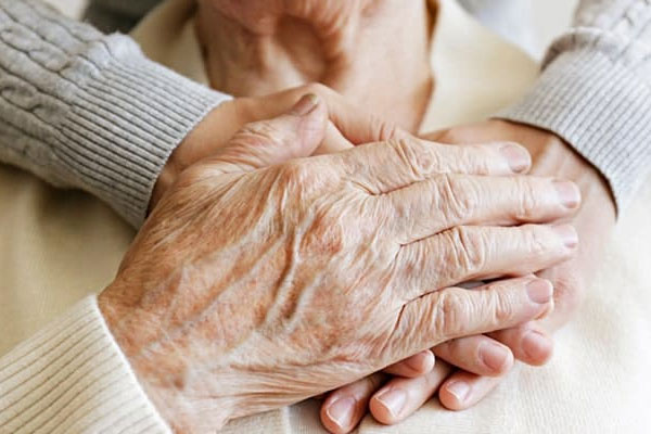 Caregiver providing companionship to elderly person